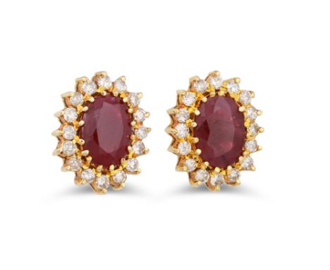 A PAIR OF RUBY AND DIAMOND CLUSTER EARRINGS, the oval rubies to a diamond surround, mounted in 18ct yellow gold
