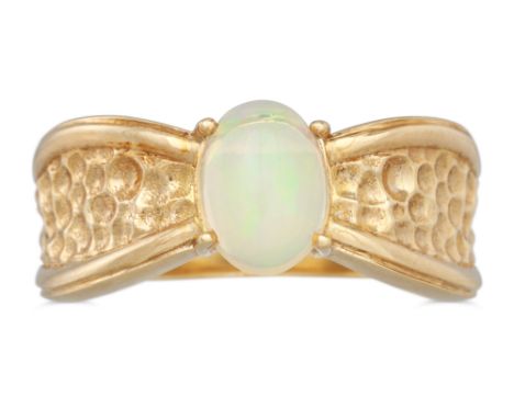 AN OPAL RING, to a textured 9ct gold mount, size M