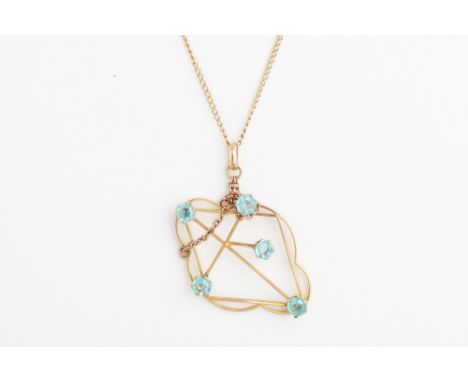 AN EDWARDIAN 9CT GOLD PENDANT, on a 14ct gold chain
