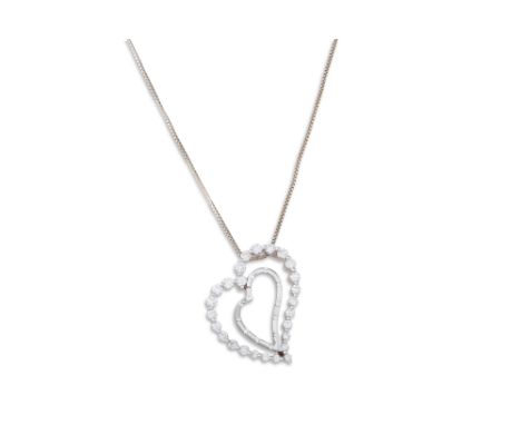 A DIAMOND PENDANT, the heart shaped pendant mounted in 18ct white gold, on a white gold chain. Estimated: weight of diamonds: