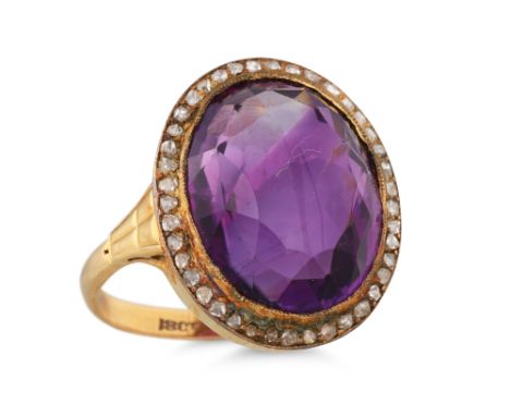 A CABOCHON AMETHYST AND ROSE CUT DIAMOND CLUSTER RING, mounted in 18ct yellow gold. Size: K