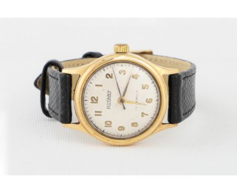 A VINTAGE GOLD GENT'S ROTARY WRISTWATCH, cream face with arabic numerals, black leather strap, back engraved and dated '55