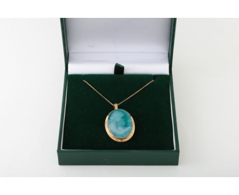 A VINTAGE 9CT GOLD CAMEO BROOCH, on a 9ct gold chain, boxed