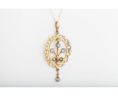 AN EDWARDIAN 9CT GOLD, SEED PEARL AND AQUAMARINE PENDANT, on a 9ct gold chain