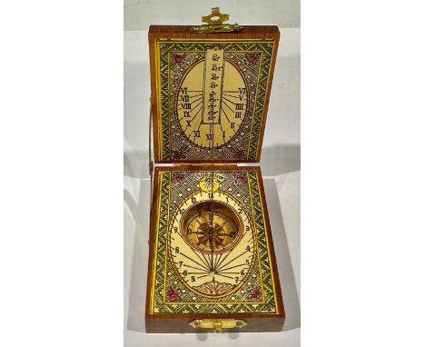 A reproduction 18th century style folding pocket compass and sun dial 