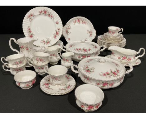 A Royal Albert Lavender Rose pattern part dinner and tea service comprising six dinner plates, six dessert bowls, two tureens