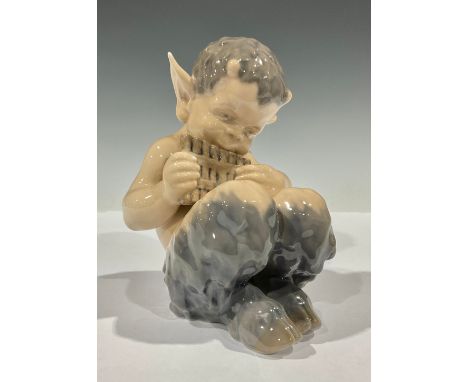 A Royal Copenhagen figure, Faun Playing Pan Flute, model no. 1736, 13.5cm high 