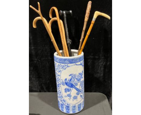 A 20th century Chinese stick stand/umbrella stand, decorated in blue and white with fanciful birds, 46.5cm high; a Victorian 