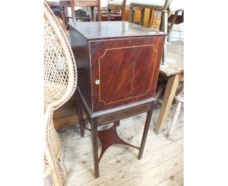 An inlaid Mahogany single door cabinet on stand