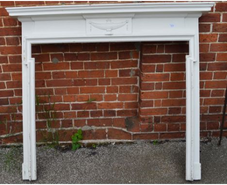 A white Adams style fireplace surround