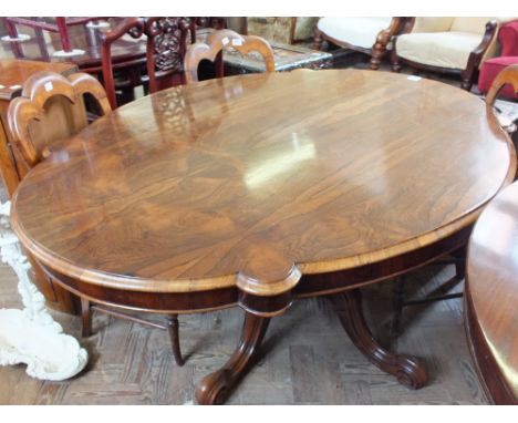 A Victorian Rosewood pedestal flip top loo table on tripod pedestal base