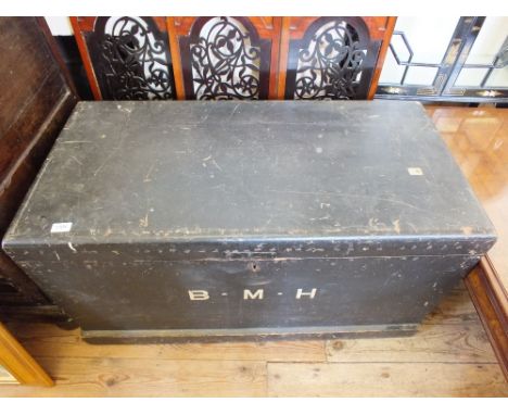 An ebonised Pine trunk inscribed with initials B.M.H.