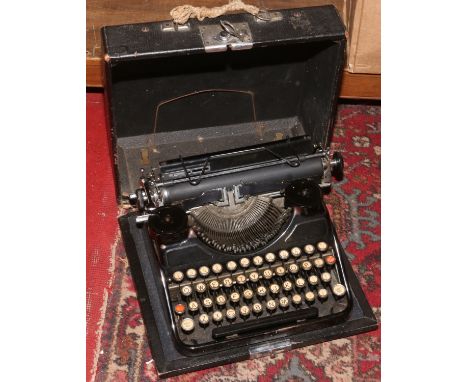 A vintage cased 'continental' type writer.