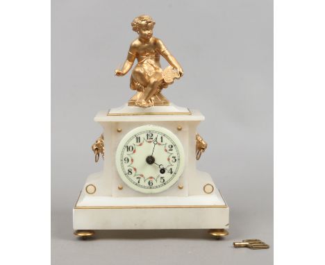 A 19th century alabaster and gilt mantle clock with key.