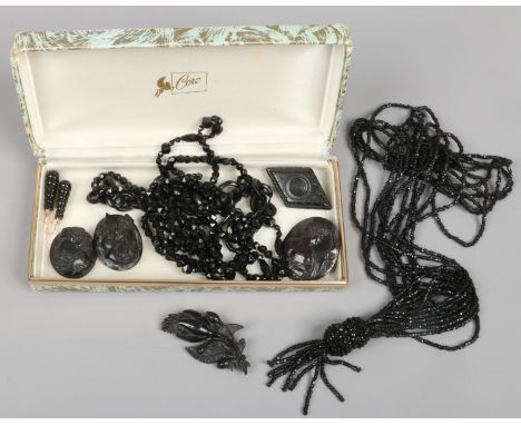 A box of vintage jet, French jet and Vulcanite jewellery.