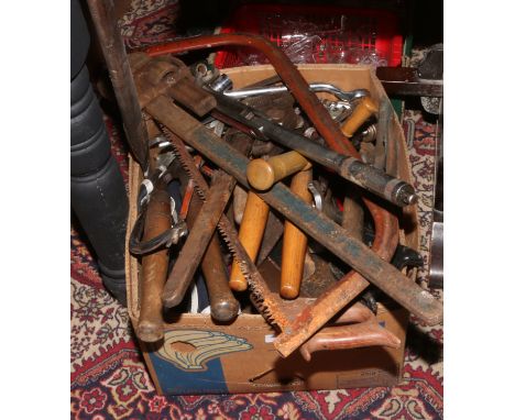 A box of tools to include large wrenches, spanners, hedge cutters, saws etc.