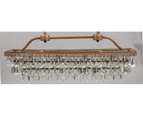 A multi glass droplet and brass rectangular formed four branch light fitting.