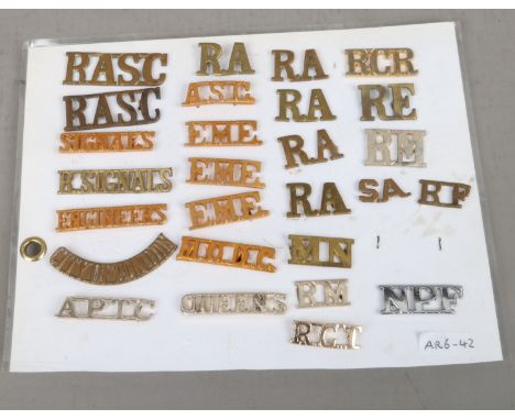 A sheet of twenty seven army title badges from various countries.