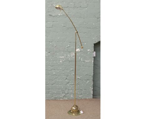A brass effect anglepoise standard lamp.