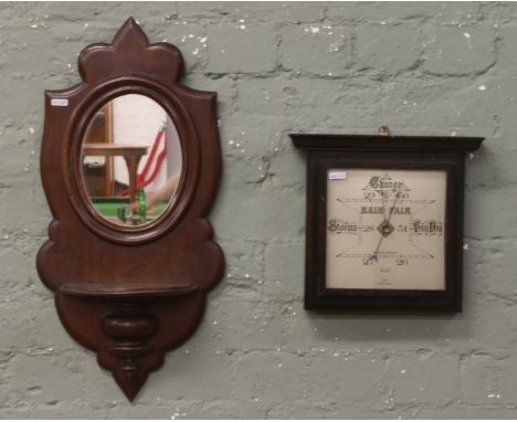 An oak cased Bell Bros wall barometer along with a mahogany wall mirror with candlestand.