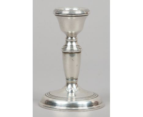 A silver candlestick with circular base assayed Birmingham 1989 by W.I. Broadway & Co.