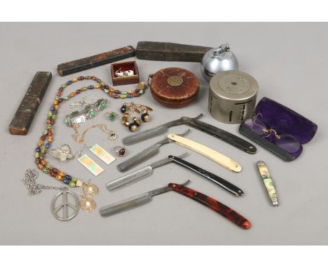 A box of collectables to include throat razors, Yorkshire penny bank, taper measure, Ronson table lighter, costume jewellery 