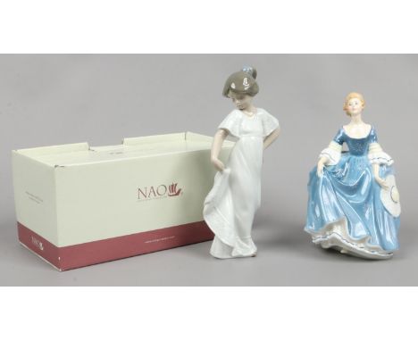 A Royal Doulton figure of a lady Hilary along with a boxed Nao figure of a girl.