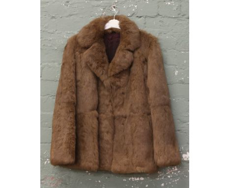 A ladies rabbit skin fur coat.