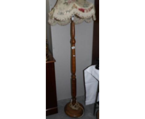 A standard lamp with shade