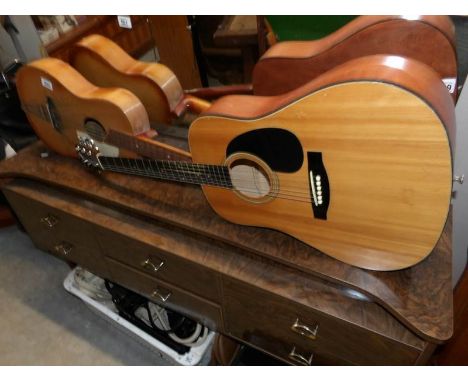 A Tanglewood acoustic guitar and a Palm Beach guitar