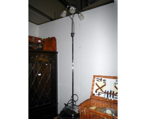 A chrome 3 branch floor standing lamp