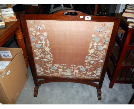 A fire screen with a Chinese silk panel