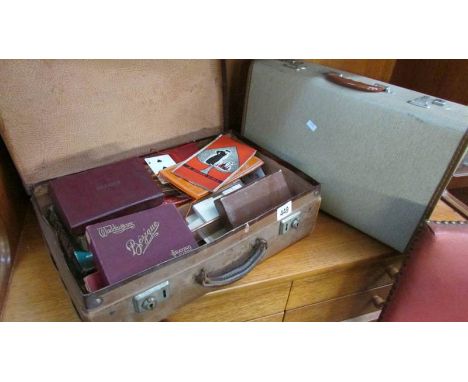 2 vintage suitcases, one containing various playing cards