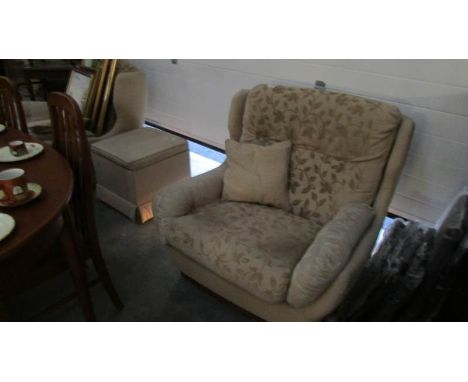 2 arm chairs and a pouffe