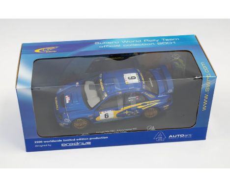 Autoart: A 1:18 Scale Model of a Subaru Impreza WRC 2001 P. Solberg / P. Mills #06 Rally Portugal, Manufacturer Autoart. Boxe