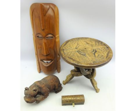 African hardwood tripod table with carved top and folding stand, African mask, H52cm, carved wood Canadian bear and an Indian