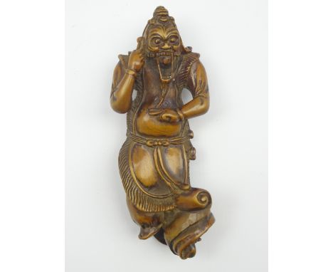 Japanese carved wood netsuke, Edo period (Late 18th-Early 19th Century) carved as a Ran Ryo-o dancer in elaborate robes, his 