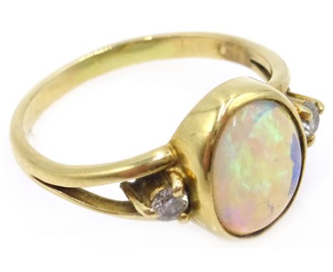 18ct gold (tested) oval opal and diamond ring  Condition Report &amp; Further Details Approx 3.7gm, size P-Q