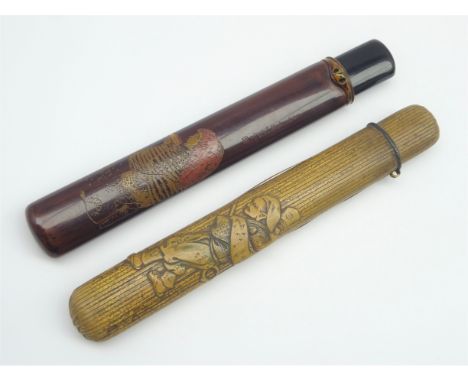 Japanese 19th Century lacquer pipe case decorated with a young girl holding a sake cup on a dark red ground signed 'Scuchikud