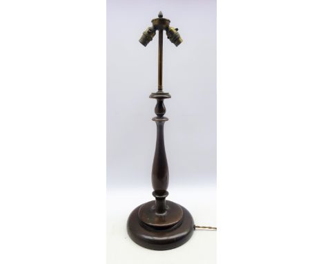 Early 20th century turned wooden table lamp with two branch brass fitting, H69cm 