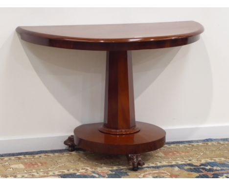 Victorian mahogany demi-lune console, octagonal column on circular platform, three carved claw feet, W106cm, H72cm, D56cm