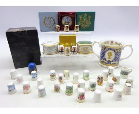 Three Royal Crown Derby thimbles, two Royal Worcester thimbles, commemorative pill boxes by the Royal Collection and Highgrov