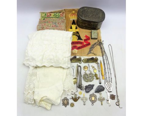 Two 19th/ early 20th century samplers, 'The Green Howards' Regimental embroidery and two cap badges, two silver shield shaped