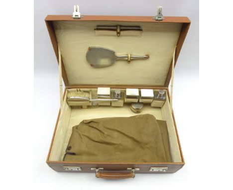 Ladies leather travelling toilet case with fitted with engine turned silver dressing table set, boxes etc Birmingham 1947