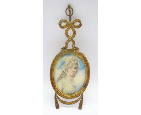 19th century miniature oval bust portrait of a young lady in a white dress, circle of Cosway, painted on ivory in gilt metal 