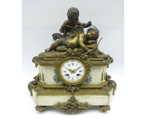 Late 19th century gilt metal and alabaster figural mantel clock, sleeping Eros and putti on cushion bed, circular dial surrou