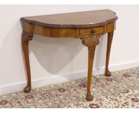 20th century walnut console table, figured and banded shaped top, single drawer, on acanthus carved cabriole supports, W101cm