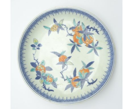 Japanese Arita dish in Kakiemon style Edo period (18th Century) modelled with rising sides decorated in underglaze blue with 