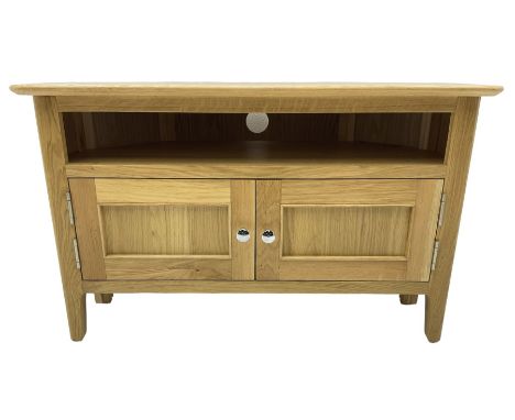 Contemporary light oak corner television stand, hexagonal top over recessed shelf, fitted with two panelled cupboard doors wi