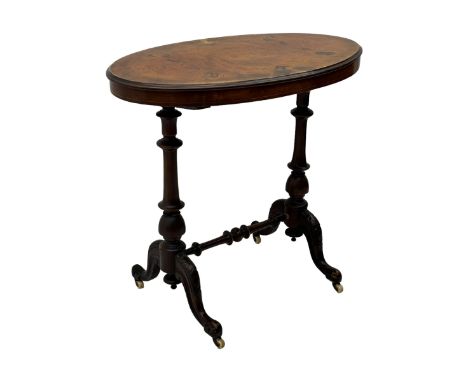 Victorian figured walnut occasional table, oval top with moulded edge, raised on turned columns joined by stretcher with cabr